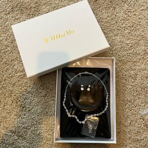 Silver Necklace with Textured Surface and Charm